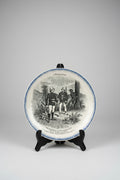 Assiette parlante Boulenger Choisy-le-Roi, série À Madagascar n° X. Terre de Fer fin XIXe, décor militaire colonial, diamètre 20 cm.