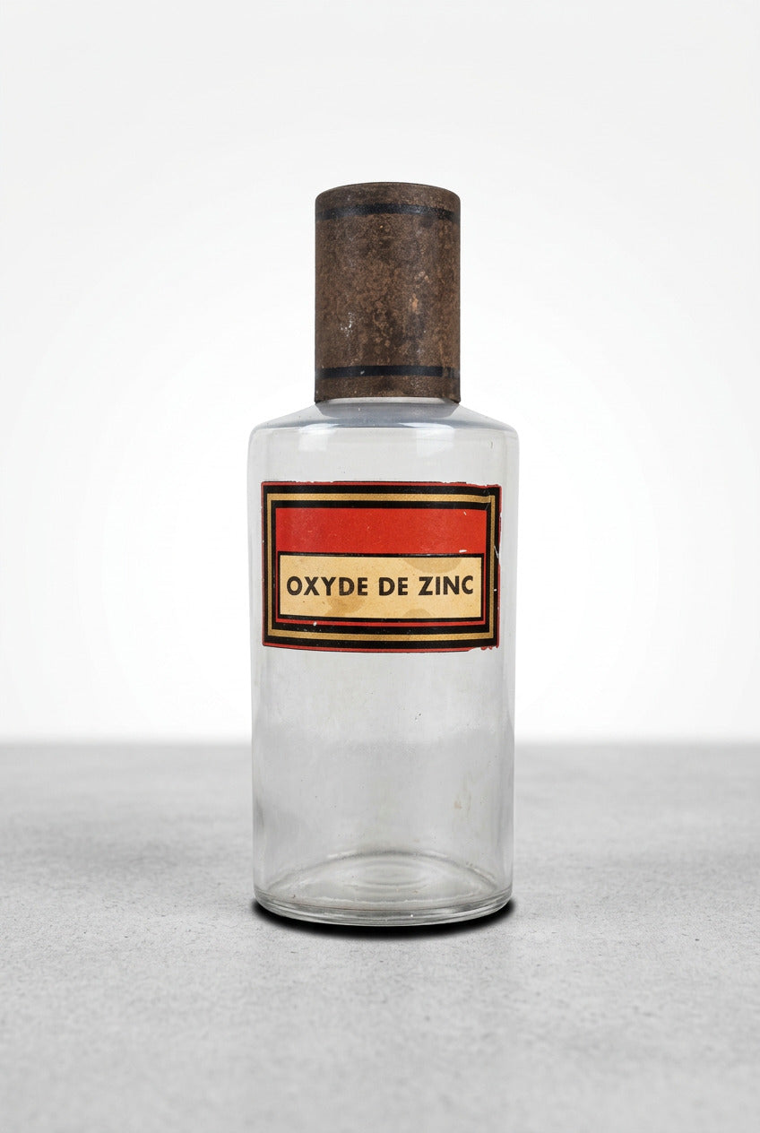 Flacon de pharmacie en verre avec étiquette Oxyde de zinc et capuchon métallique oxydé