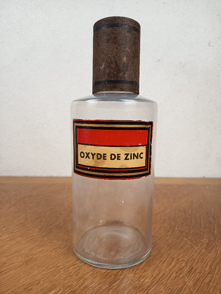 Flacon de pharmacie en verre avec étiquette Oxyde de zinc et capuchon métallique oxydé