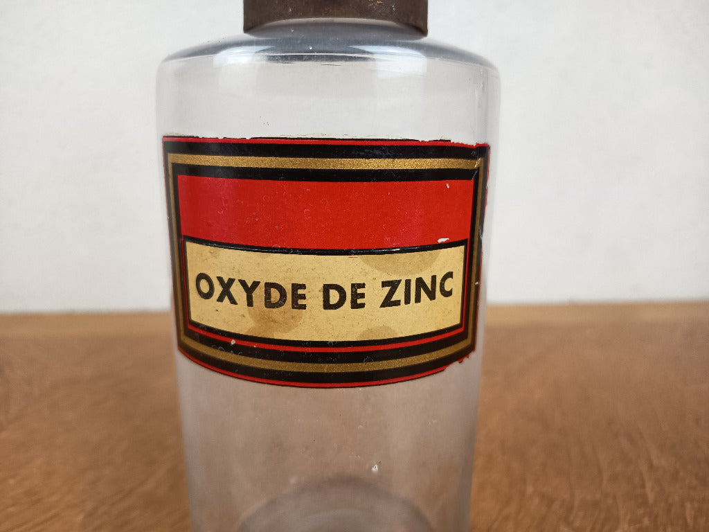 Flacon de pharmacie en verre avec étiquette Oxyde de zinc et capuchon métallique oxydé